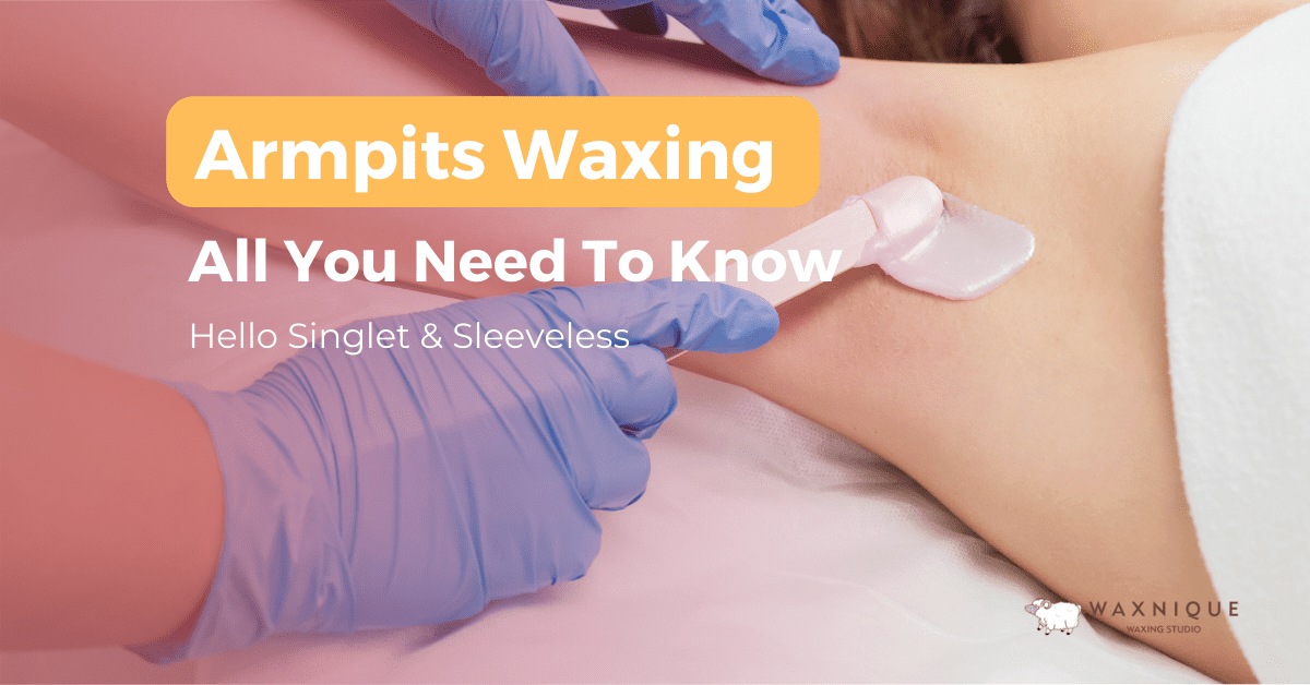 applying wax to remove armpit hair